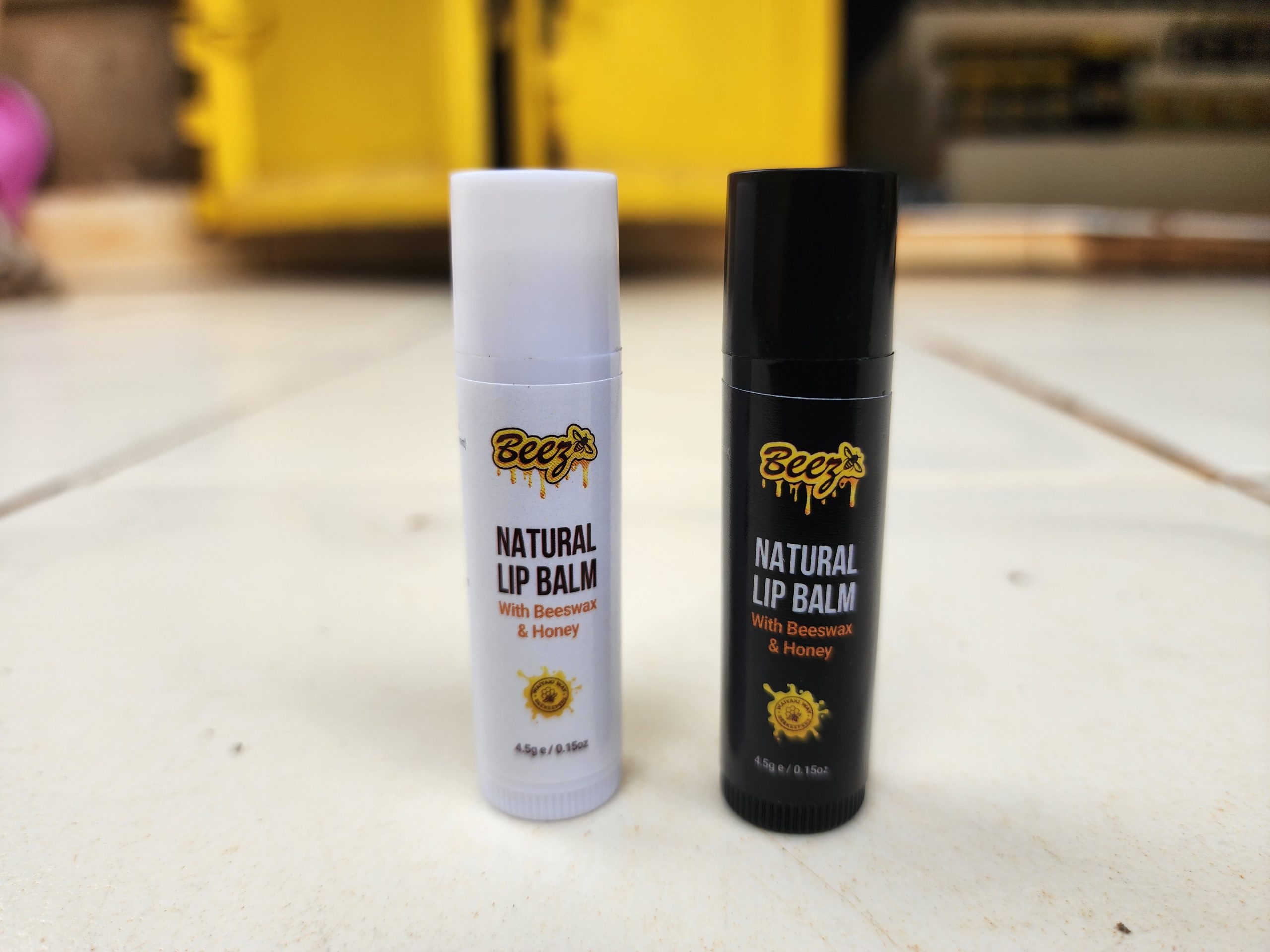 Beez Natural Lip Balm tubes with raw honeycomb and beeswax pellets